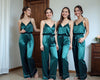 Group of bridesmaids in dark teal satin cami pajama sets, ideal for bridesmaid pajamas, bridal party pajamas, and wedding morning getting ready outfits. Luxe silky loungewear with adjustable straps and tie-waist pants, perfect for bridal photos, sleepovers, and coordinated bridal party gifts.
