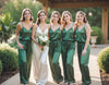 Bride in personalized white satin cami pajama set standing with bridesmaids in matching personalized green silky pajamas. Perfect for bride pajamas, bridesmaid pajamas, bridal party pajamas, and wedding day getting ready outfits. Elegant bridal loungewear designed for photos, comfort, and coordinated bridal styling.