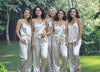 Bridal party in matching personalized ivory satin cami pajama sets, ideal for bride pajamas, bridesmaid pajamas, bridal party pajamas, and elegant outdoor wedding morning photos. Soft silky loungewear with drawstring pants, perfect for getting ready outfits, bridal gifts, and coordinated pre-wedding look